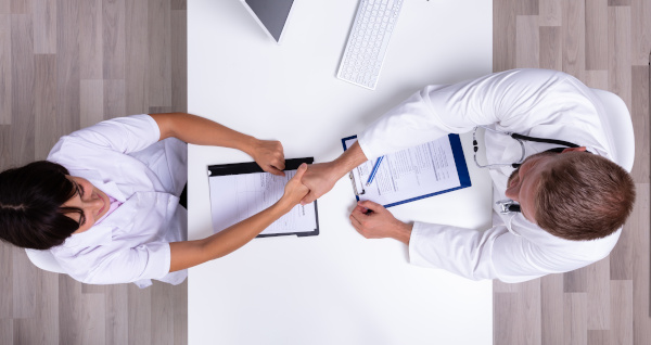 Overhead View: Nurse Job Interview, Handshake